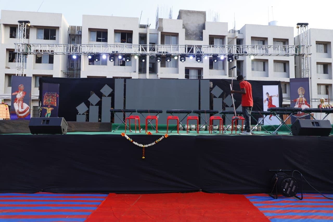 Wide view of the open-air stage and its speaker stacks before the show