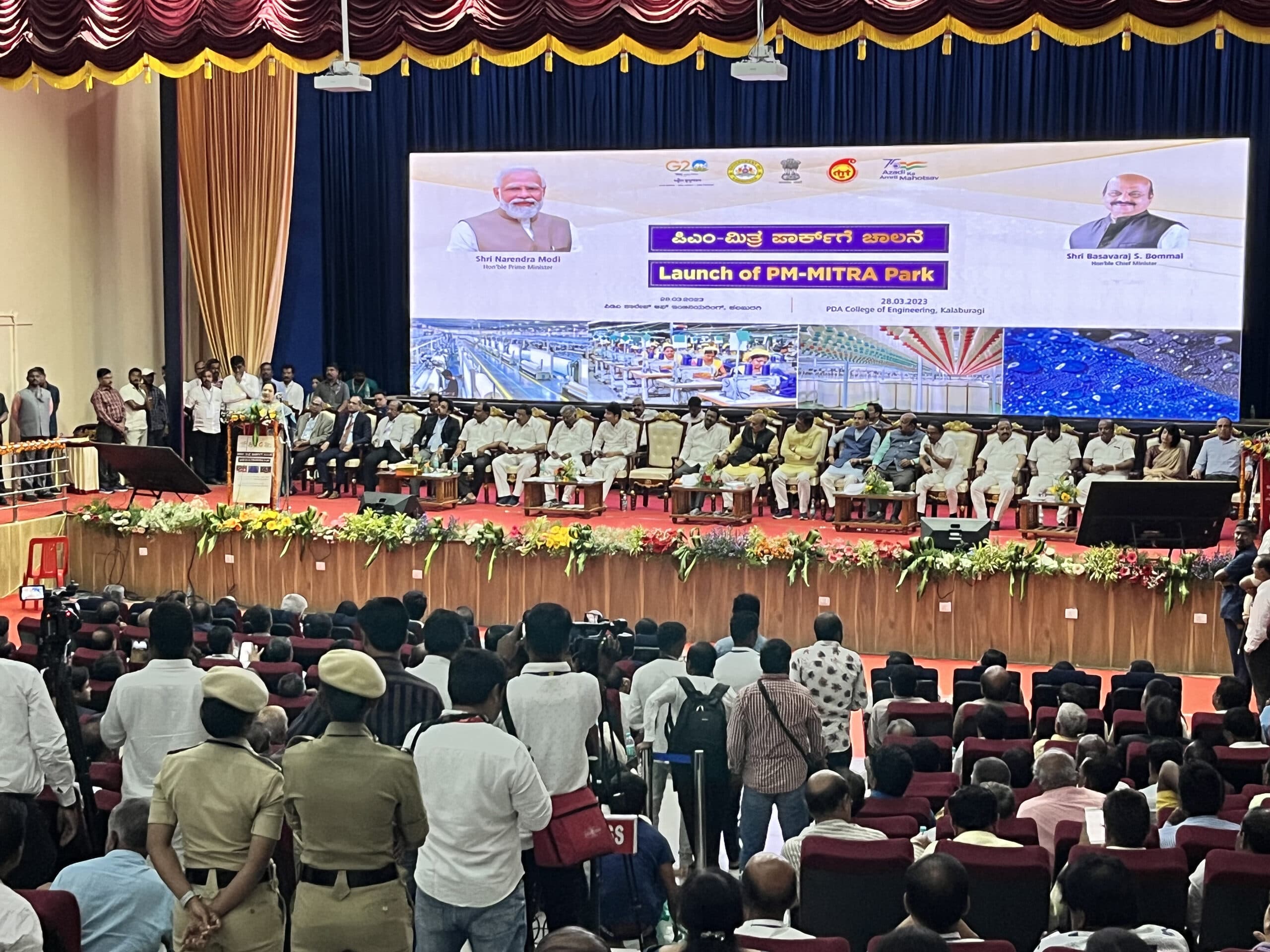 Dignitaries banked across the flower-fronted dais beneath the launch announcement screen