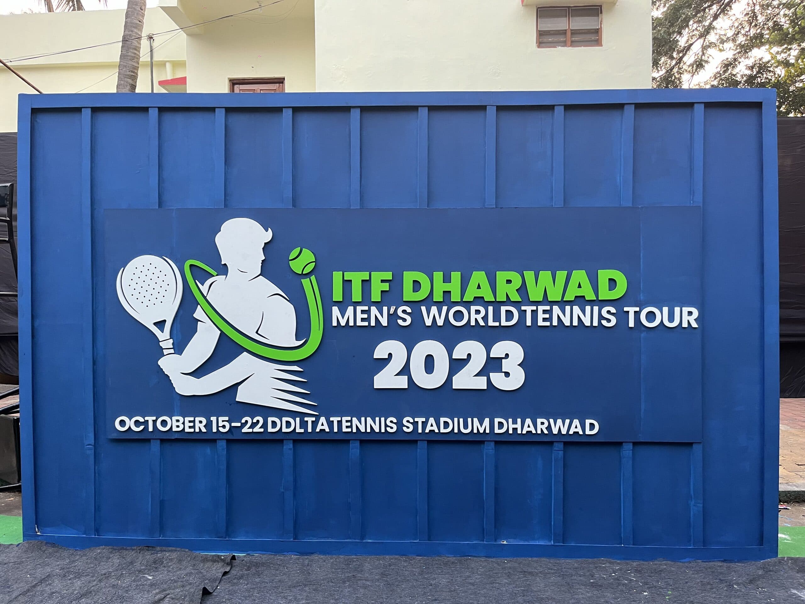 Event sign for the ITF Dharwad Men's World Tennis Tour 2023 at DDLTA Tennis Stadium