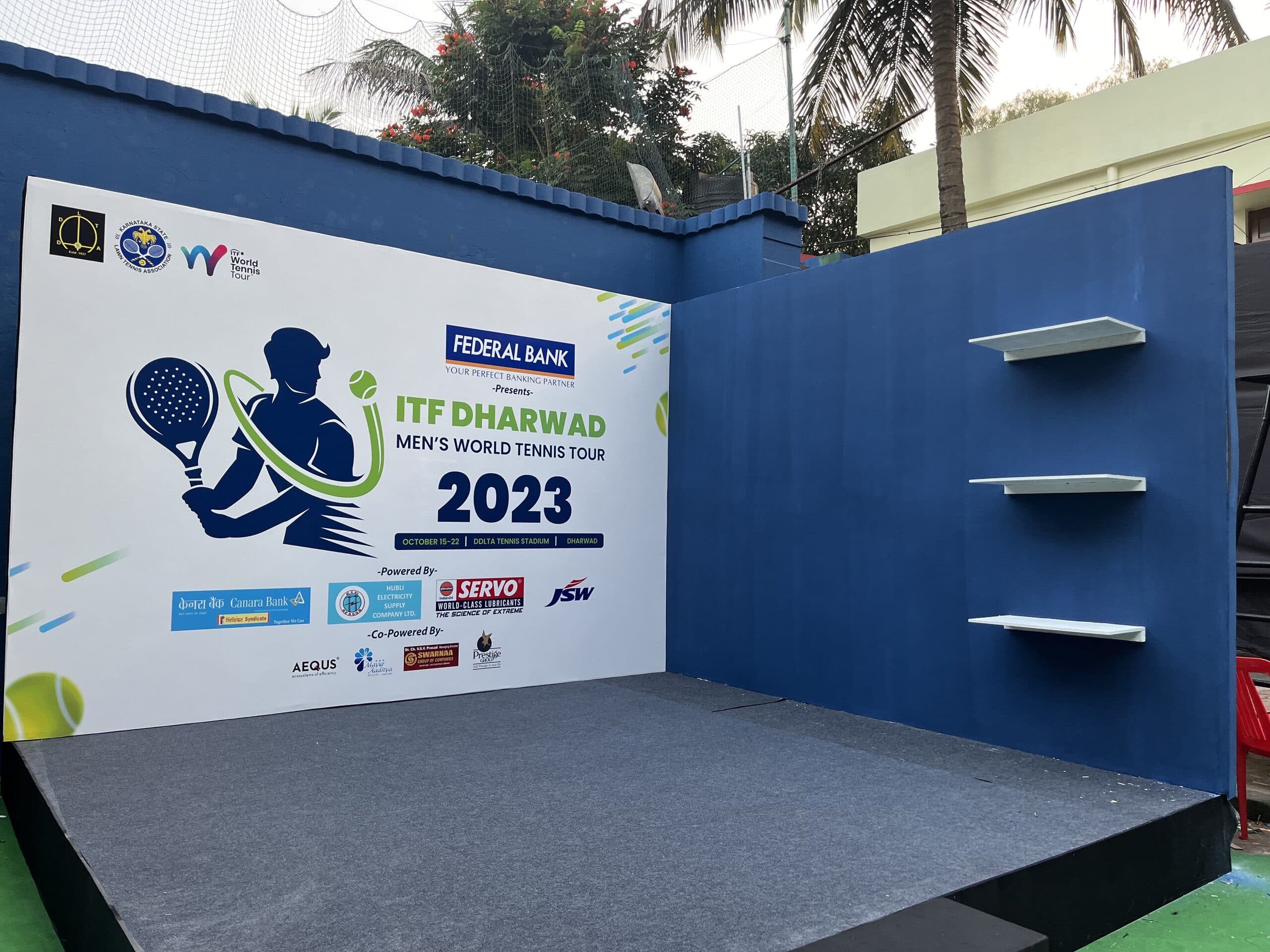 Branded ITF Dharwad photo backdrop at the tournament venue