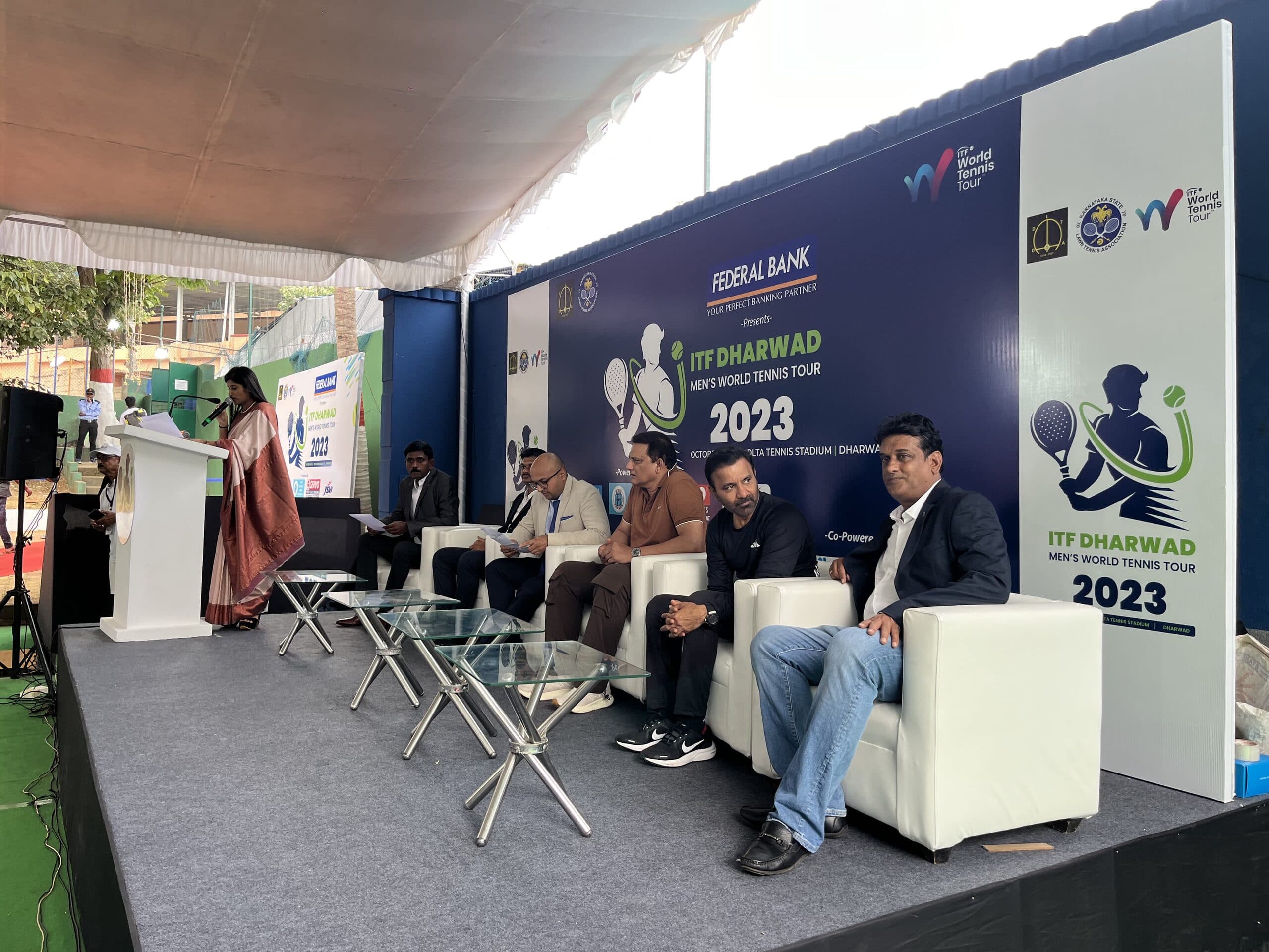Side view of the seated ITF Dharwad event panel
