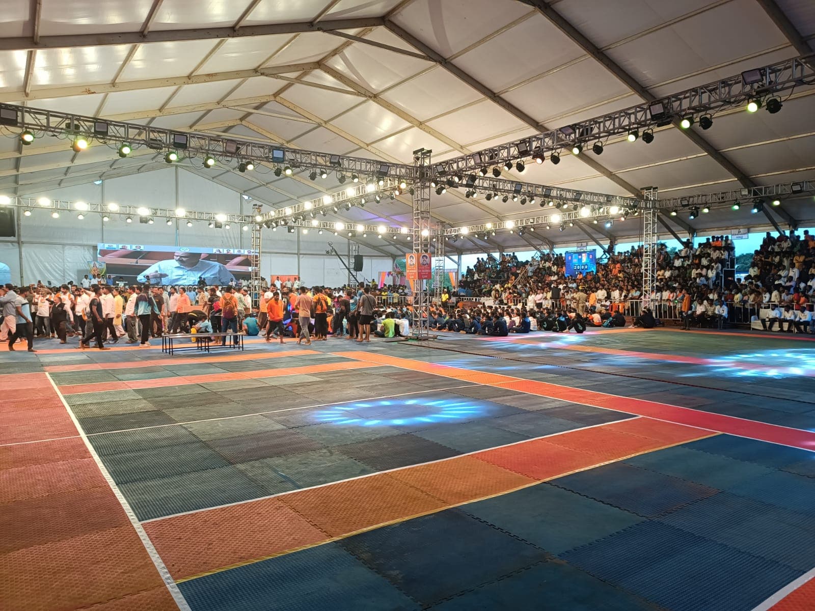 Savanur Kabaddi Utsav arena with lighting rig, coloured mats and packed stands