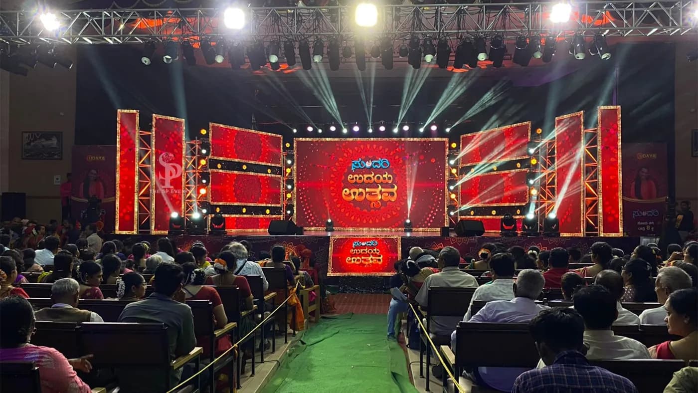 Red LED stage before a seated festival audience