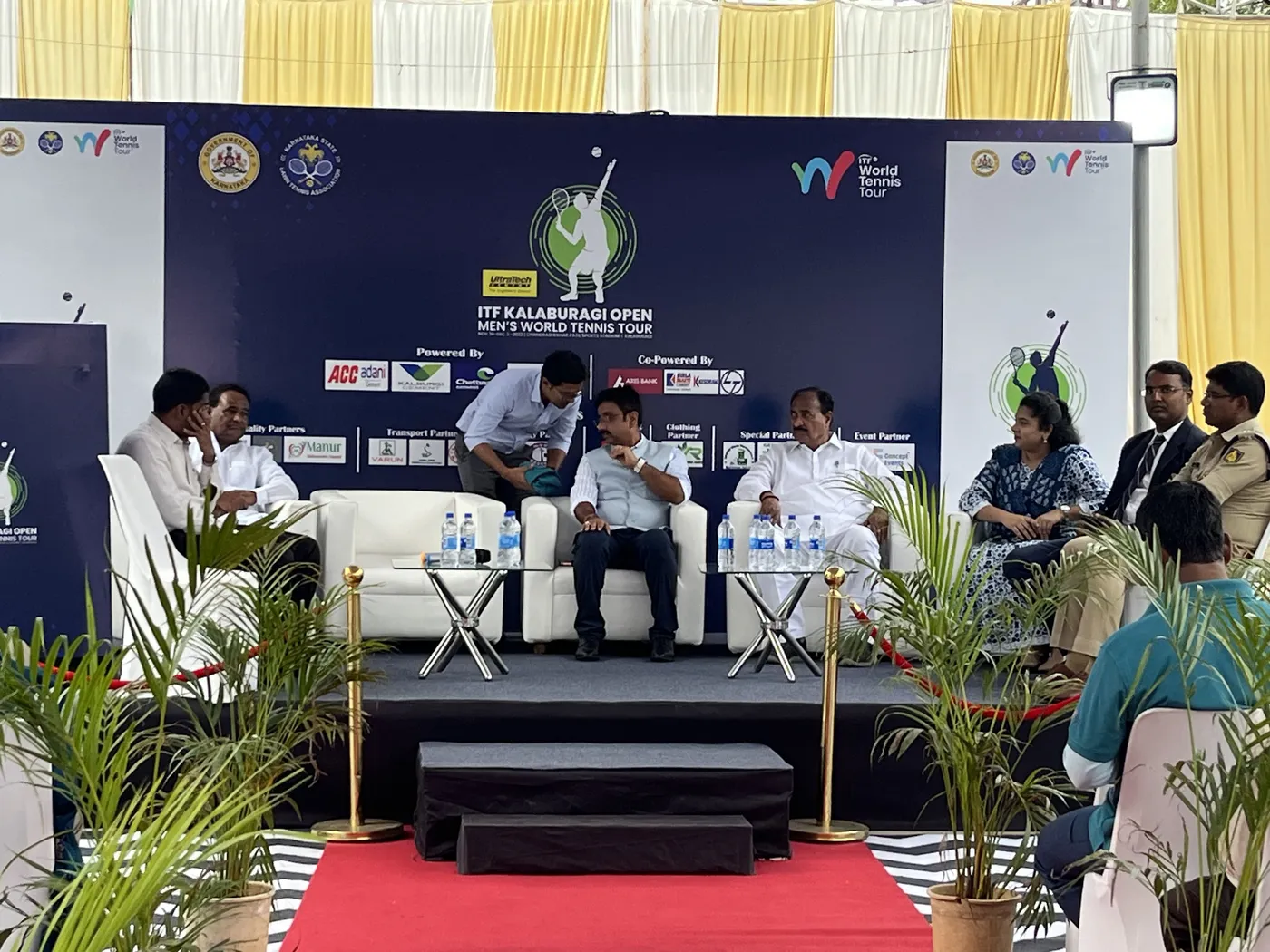 Tournament panel on stage with a red carpet
