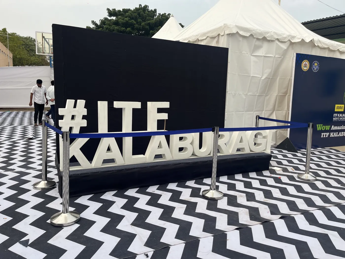 #ITF Kalaburagi lettering on a chevron floor