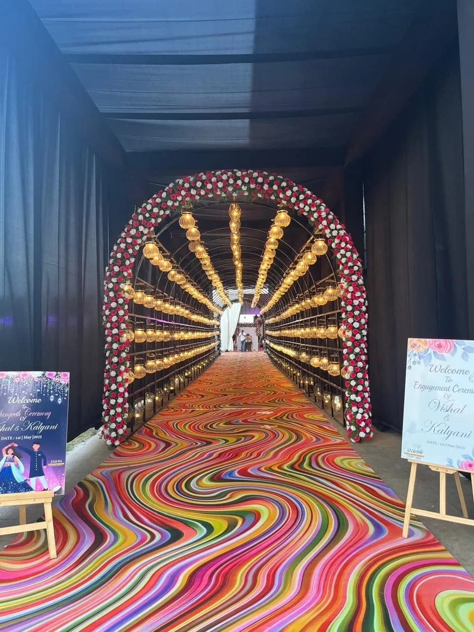 Gold sunburst arch over a patterned aisle